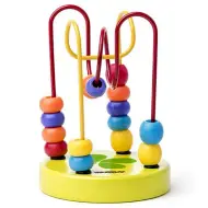 Gioco in legno con mini palline verdi